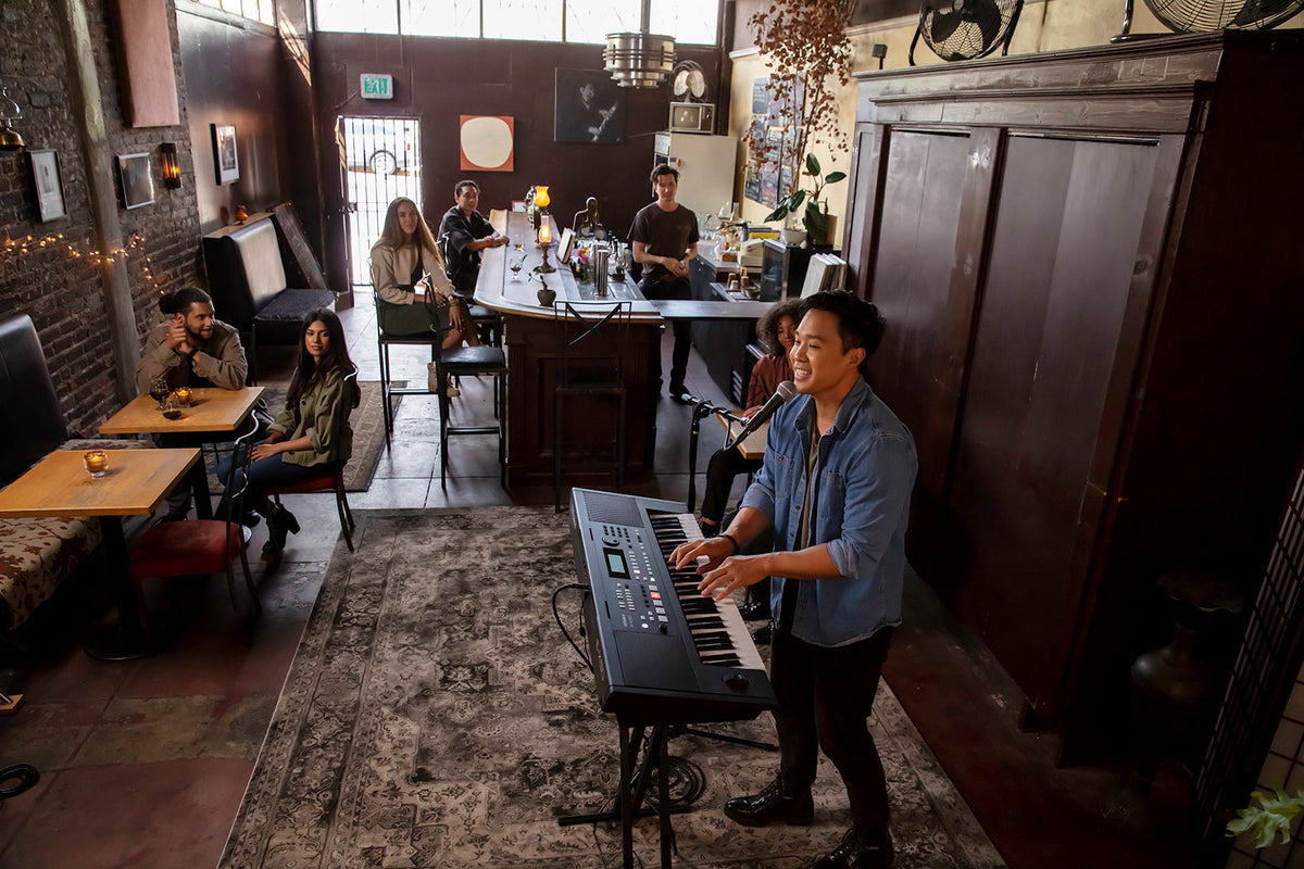 Roland E-X50 arranger keyboard being performed live