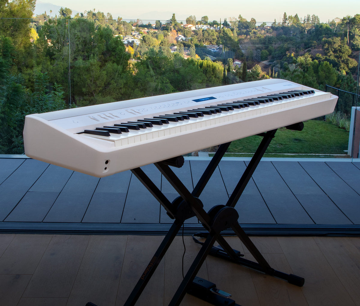 Roland FP-90X digital piano in a home performance setting