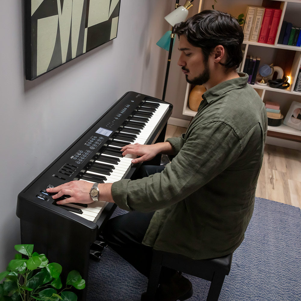 Roland FP-E50 digital piano being played at home