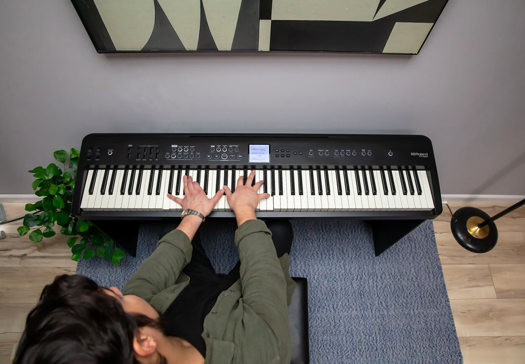 Roland FP-E50 digital piano in a home setting