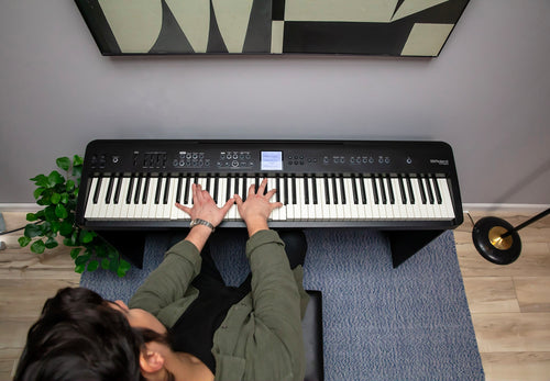 Roland FP-E50 digital piano in a home setting